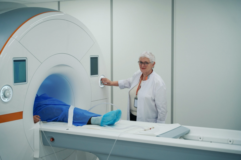 Radiology technologist preparing a patient for an MRI after a car accident