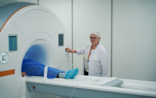 Radiology technologist preparing a patient for an MRI after a car accident